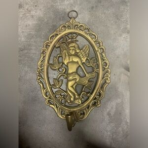 Vintage brass wall art with hook